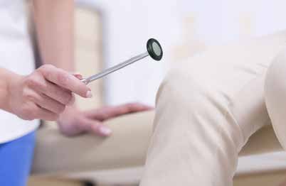 A reflex hammer being used during a neurological examination