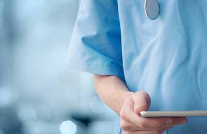 A clinician taking notes on a tablet